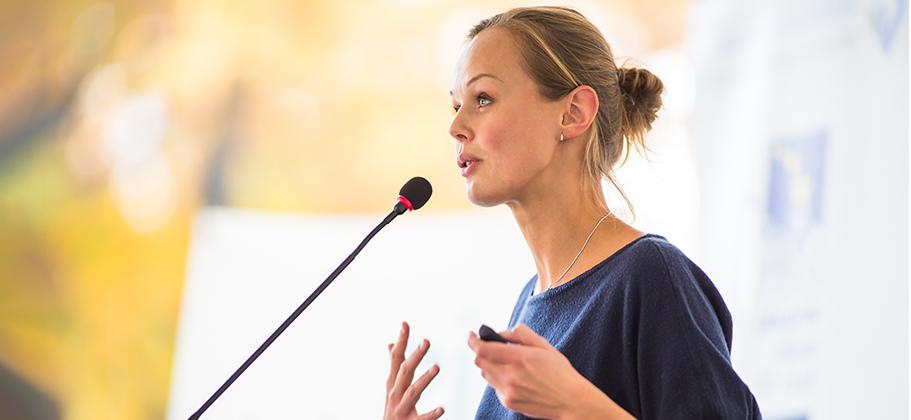 Woman Speaking at a Conference